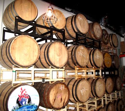 The wall of barrels filled with various spirits and cordials.